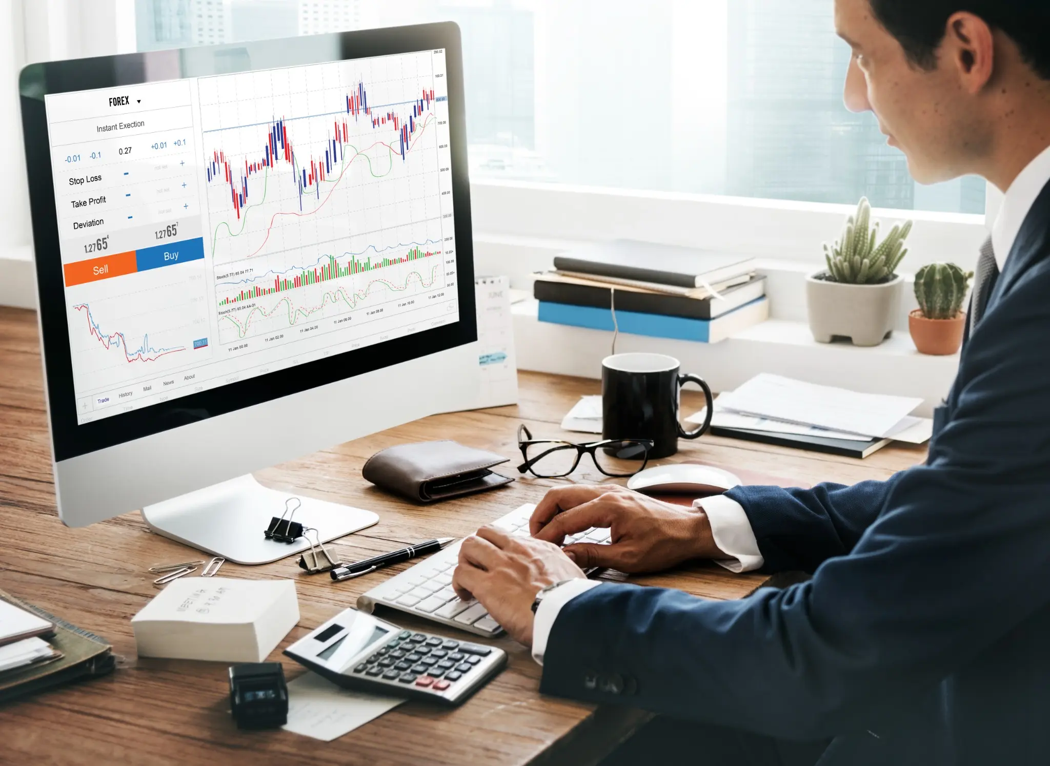 Market professional studying financial charts at a workstation